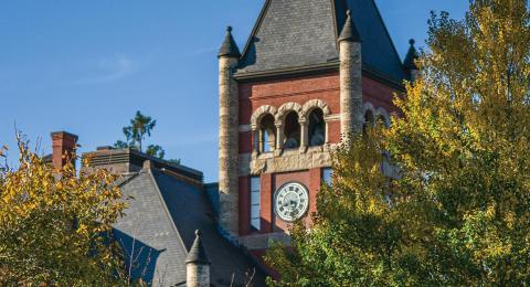 Thompson Hall clock tower with fall foliage